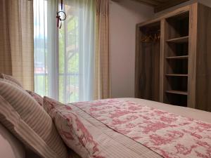 Postel nebo postele na pokoji v ubytování Apartmány POCO LOCO