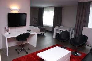 Televiisor ja/või meelelahutuskeskus majutusasutuses Hotel Panorama