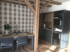 Kuchyň nebo kuchyňský kout v ubytování Apartmány POCO LOCO