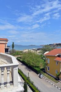 a view of the ocean from the balcony of a house at Anvers Apartments in Sozopol