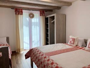 Postel nebo postele na pokoji v ubytování Apartmány POCO LOCO