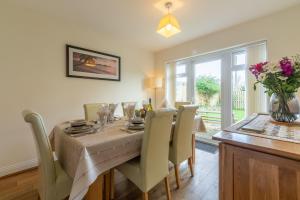 a dining room with a table and chairs at Porthia in Hayle