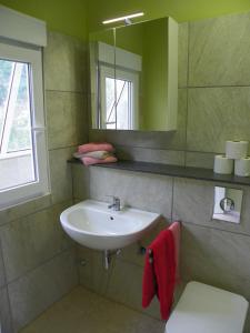 a bathroom with a sink and a mirror at Casa-Palo-Pique in Icod de los Vinos