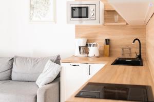 Kuchyň nebo kuchyňský kout v ubytování Apartamenty w Świnoujściu