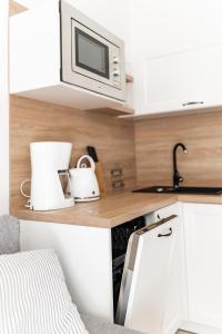 Kuchyň nebo kuchyňský kout v ubytování Apartamenty w Świnoujściu