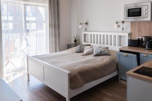 Postel nebo postele na pokoji v ubytování Apartamenty w Świnoujściu