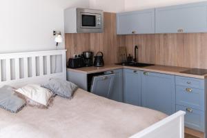 Kuchyň nebo kuchyňský kout v ubytování Apartamenty w Świnoujściu