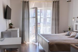 TV a/nebo společenská místnost v ubytování Apartamenty w Świnoujściu