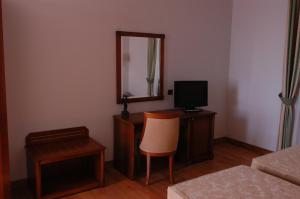 TV a/nebo společenská místnost v ubytování Pilgrim's Hotel