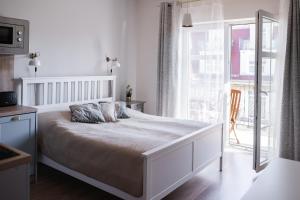 Postel nebo postele na pokoji v ubytování Apartamenty w Świnoujściu