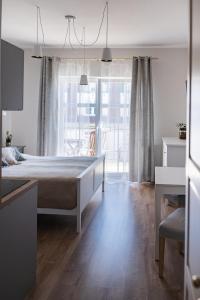 Postel nebo postele na pokoji v ubytování Apartamenty w Świnoujściu