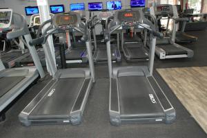 a row of treadmills in a gym at Days Inn by Wyndham Dyersburg in Dyersburg
