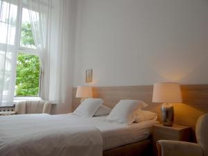 Posteľ alebo postele v izbe v ubytovaní Boutique Aparthotel