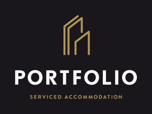 a yellow and white logo on a black background at Portfolio Apartments - Welwyn Business Park in Welwyn Garden City