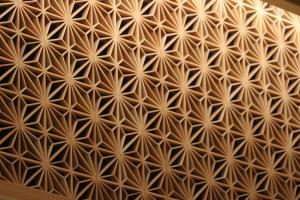 an image of a repeating pattern on a wall at Cabin & Capsule Hotel J-SHIP Osaka Namba in Osaka