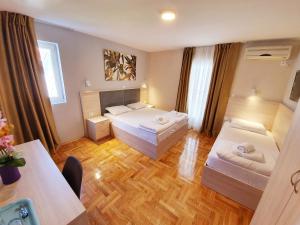 Krevet ili kreveti u jedinici u okviru objekta Apartments Pier