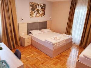 Krevet ili kreveti u jedinici u okviru objekta Apartments Pier