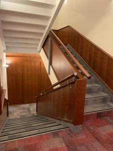 a set of stairs in a building with a stair case at Hotel Mantova in Vrhnika