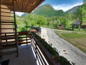 a balcony of a house with a view of a road at Holiday Home Over The River in Bovec