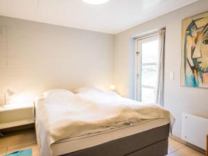 Postel nebo postele na pokoji v ubytování Holiday home Henne XIII