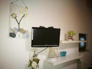 Телевизор и/или развлекательный центр в Corte Del Borgo Antico