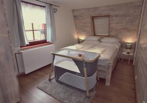 Postel nebo postele na pokoji v ubytování Ubytování pod Rozhlednou