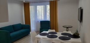 Część wypoczynkowa w obiekcie Apartament Przy Lesie Słoneczne Tarasy