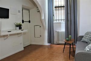 a living room with a couch and a window at Crystal Ship Apartments in Florence