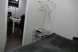 a glass shelf in a room next to a table at Kleine Harzflucht in Altenau