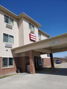 a building with a sign that reads reunion inn at The Edgewood Hotel and Suites in Fairbury