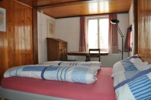 Postel nebo postele na pokoji v ubytování Ferienwohnung ob Vierwaldsättersee