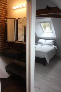 Postel nebo postele na pokoji v ubytování Chambre chez l'habitant Les Aubes du Vexin