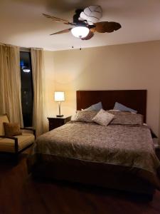 a bedroom with a bed and a ceiling fan at 1215 A Slice of Heaven - Destin! Pool View! in Destin