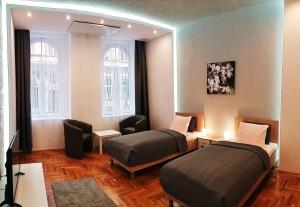 Ένα ή περισσότερα κρεβάτια σε δωμάτιο στο UNIQUE TOWN APARTMENT. CLEAR COMFORT.