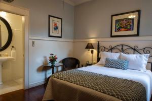 Rúm í herbergi á Grano de Oro Hotel