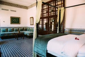 Postel nebo postele na pokoji v ubytování La Maison Bleue Batha