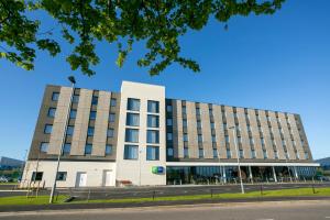 an office building on a street with a blue sky at Holiday Inn Express Bridgwater M5, Jct24, an IHG Hotel in Bridgwater
