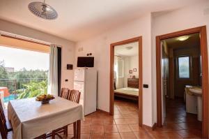 Telewizja i/lub zestaw kina domowego w obiekcie Residence Villa Andrea