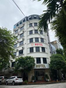 a hotel building with a hotel sign on it at X9 Hotel in Hà Ðông