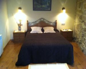 Cama o camas de una habitación en As Chivas
