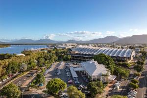 a large body of water with a large building at Piermonde Apartments Cairns in Cairns