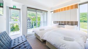 מיטה או מיטות בחדר ב-Kizuna