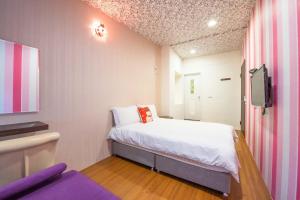 Katil atau katil-katil dalam bilik di Luodong Nightmarket Homestay