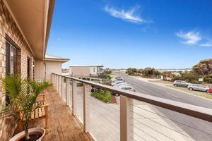 a balcony of a house with a view of a street at Marine Cove Resort in Goolwa South