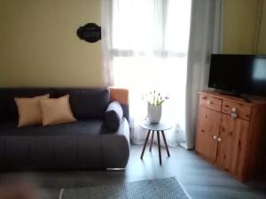 A seating area at Kőszeghegyalja Vendégház