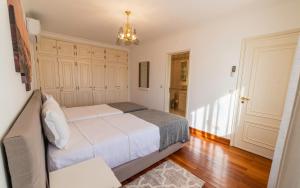 En eller flere senger på et rom på Four Seasons Vilamoura