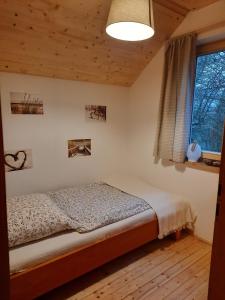 Tempat tidur dalam kamar di Jagdhaus im Grünen, mit Sauna