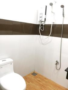 a bathroom with a toilet and a shower at Hoa Trang Hotel in Tuy An