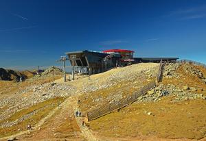 a building on top of a hill with a building on it at Noc na Chopku, Rotunda in Belá
