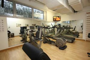 a gym with treadmills and elliptical machines at Relais Bellaria Hotel & Congressi in Bologna